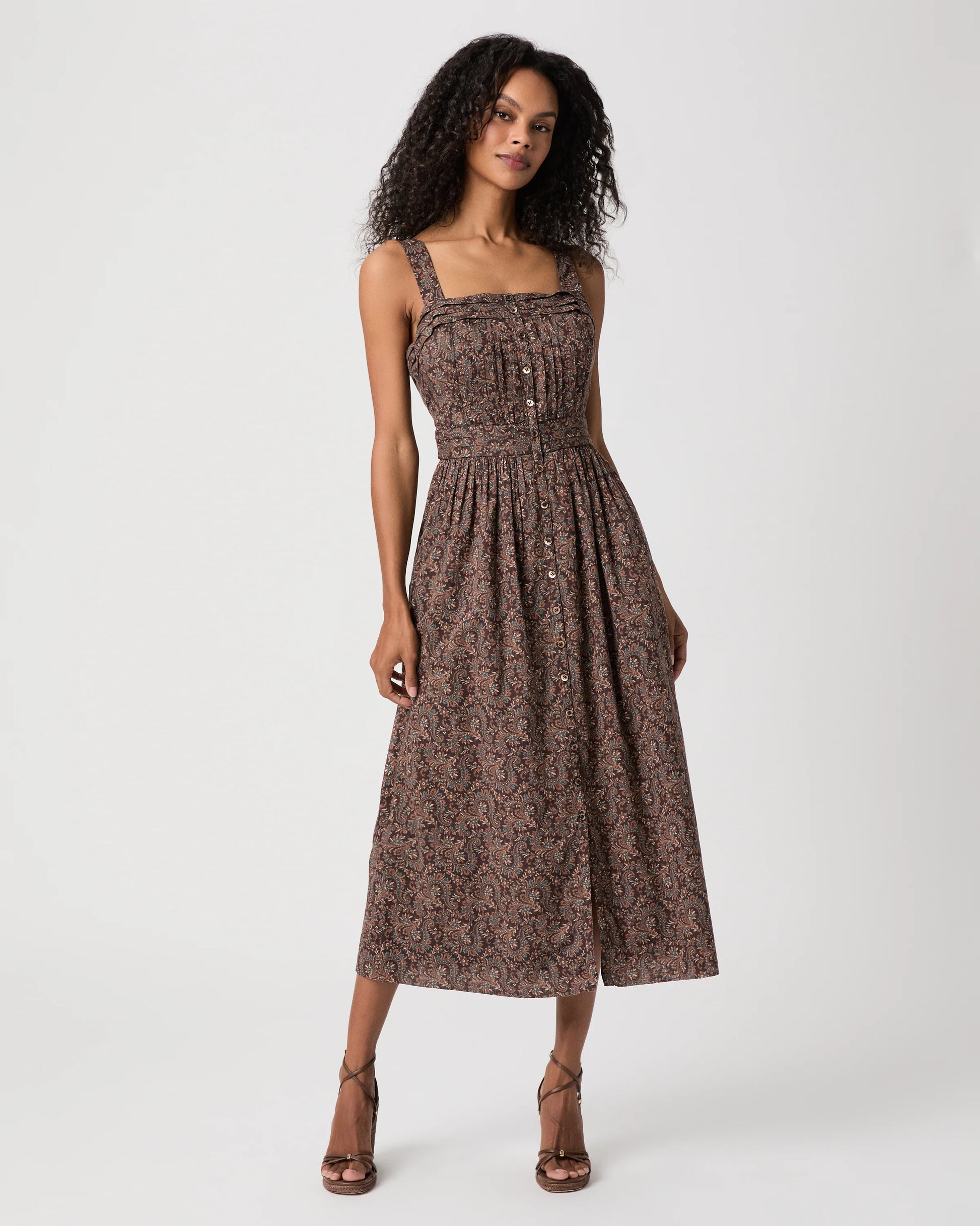 Woman modelling brown paisley dress