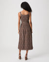 Woman modelling brown paisley dress rear view