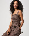 Woman modelling brown paisley dress close up