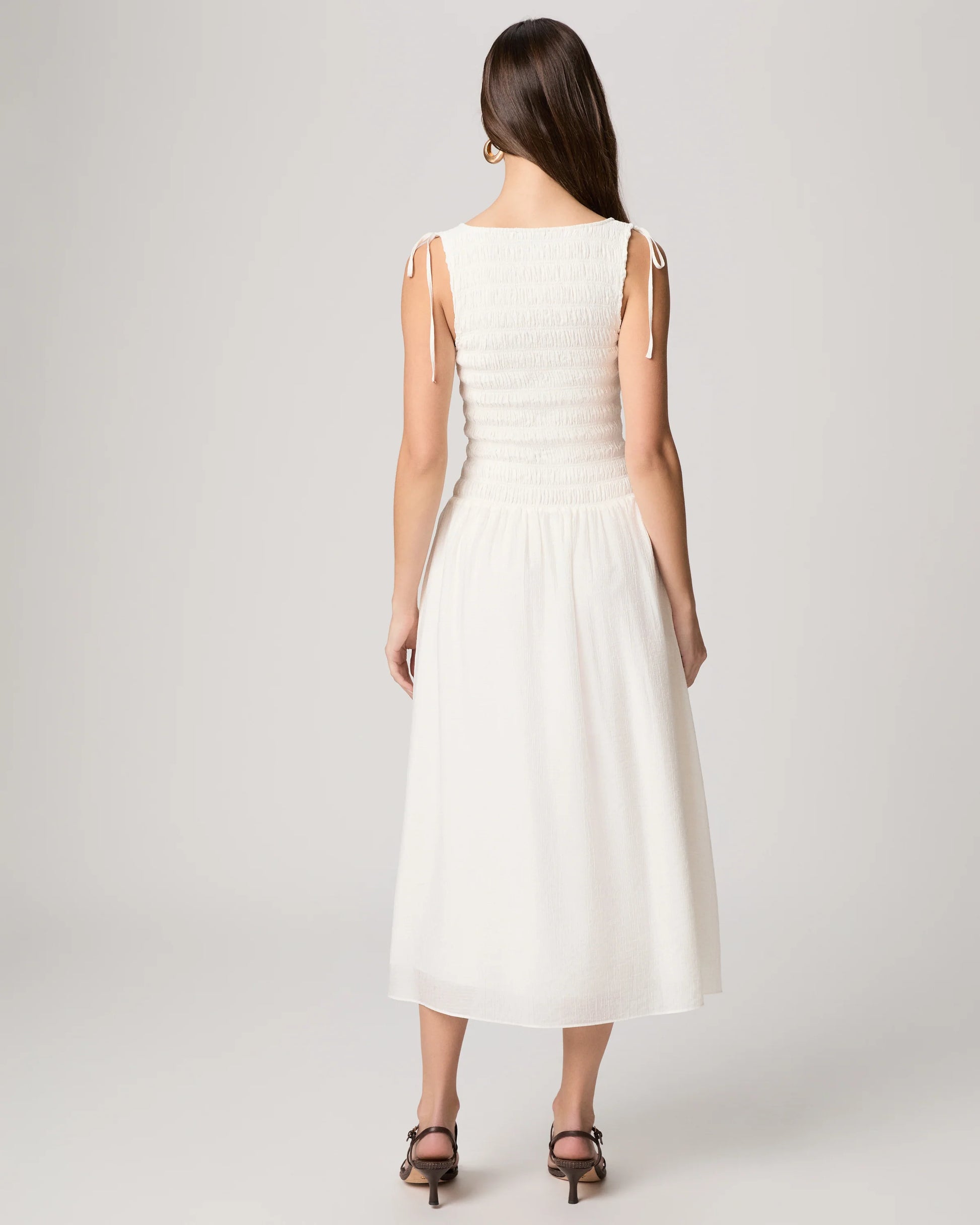 Rear view of white summer dress from Paige