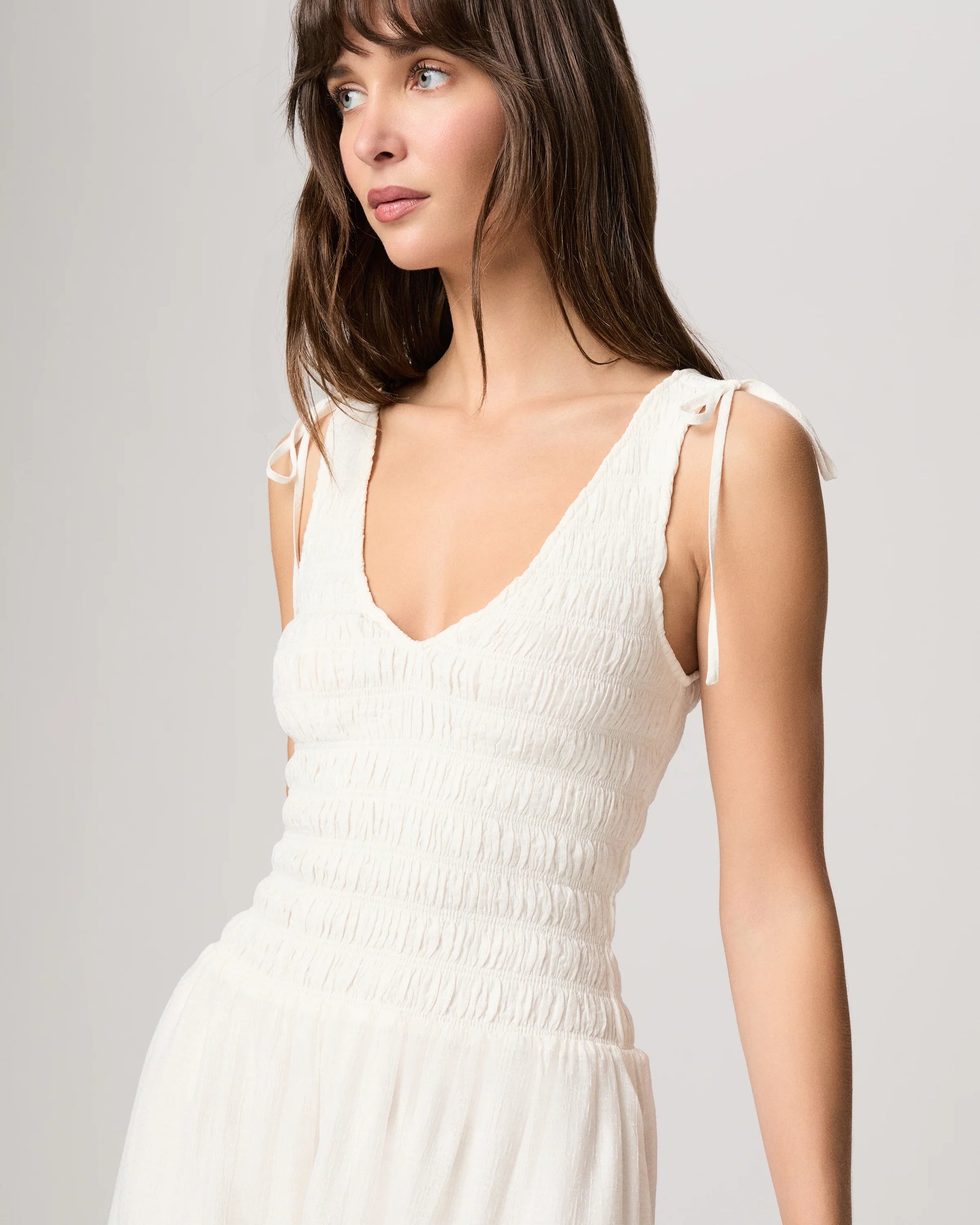 Top detail of white summer dress from paige