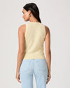 Woman wearing a light yellow sleeveless Paige top and light blue jeans on a plain background rear view
