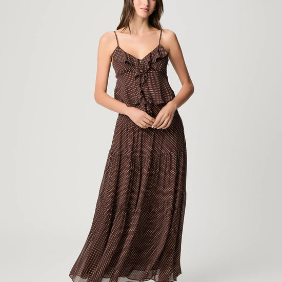 woman wearing polka dot cami with ruffle and matching skirt