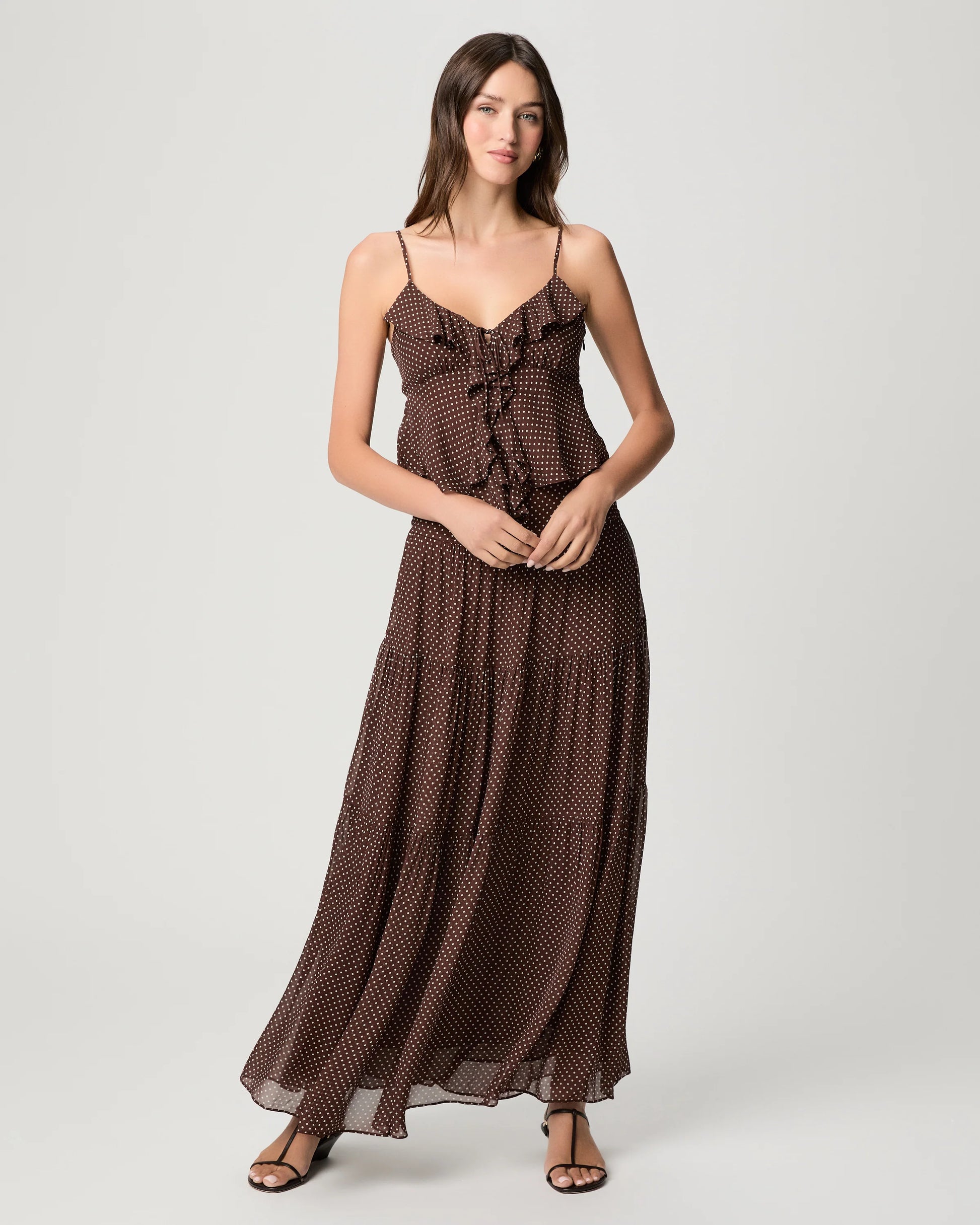 woman wearing polka dot cami with ruffle and matching skirt