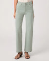 Light green jeans worn by a person on a white background