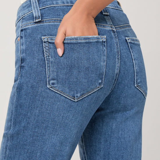 Close up of pocket detail on pale blue jeans