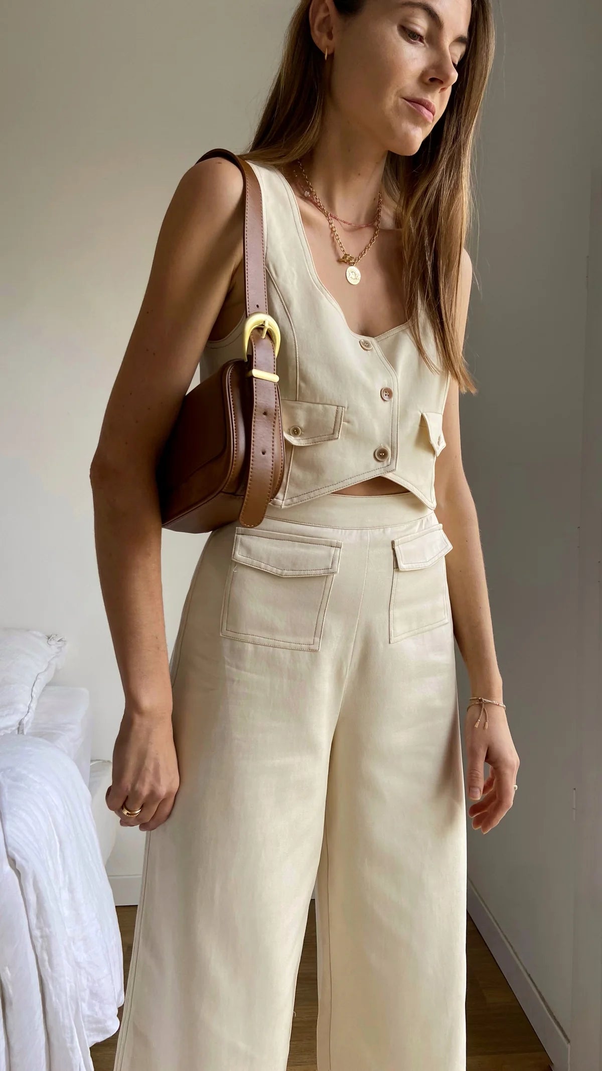 Cream cropped waistcoat with button fastening and two front patch pockets