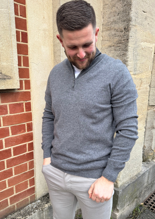 Male model wearing grey cashmere quarter zip jumper.