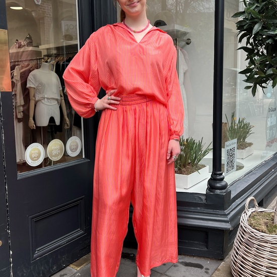 Loose orange and pink stripe trousers\