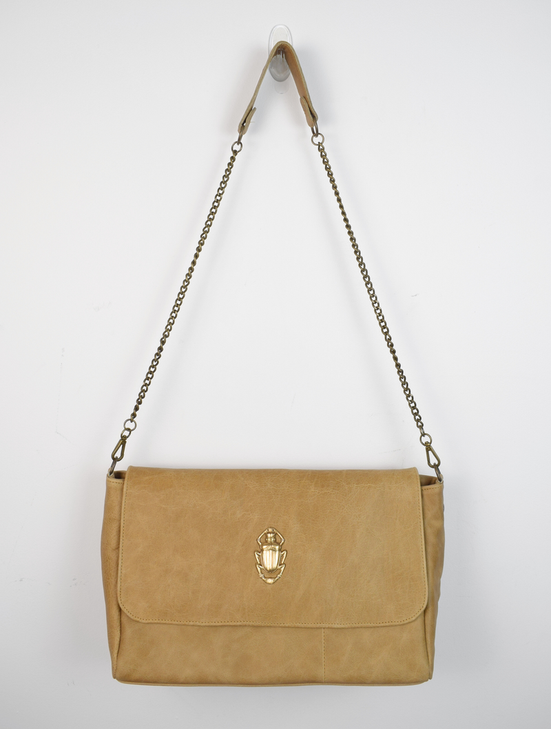 suede bag with gold scarab detail