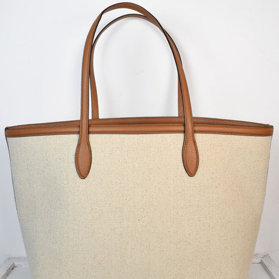 Neutral canvas totoe with tan leather trim