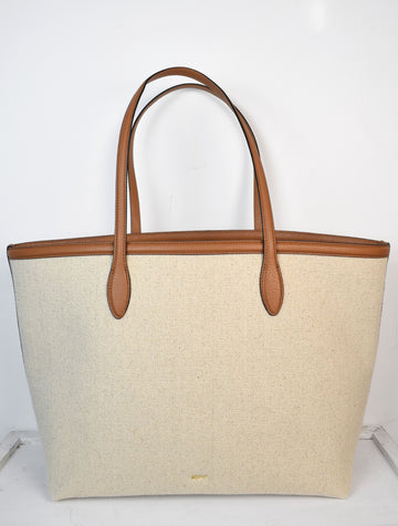 Neutral canvas totoe with tan leather trim