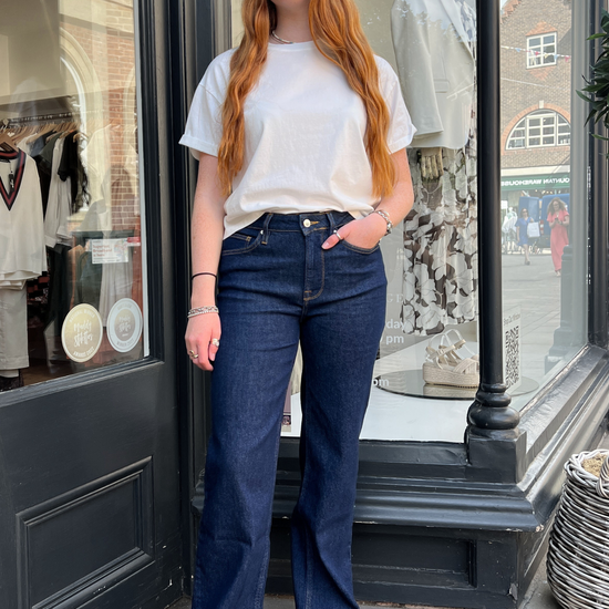 Dark navy jeans with a white top 