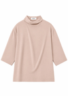 flat lay of a blush pink blouse on a white background