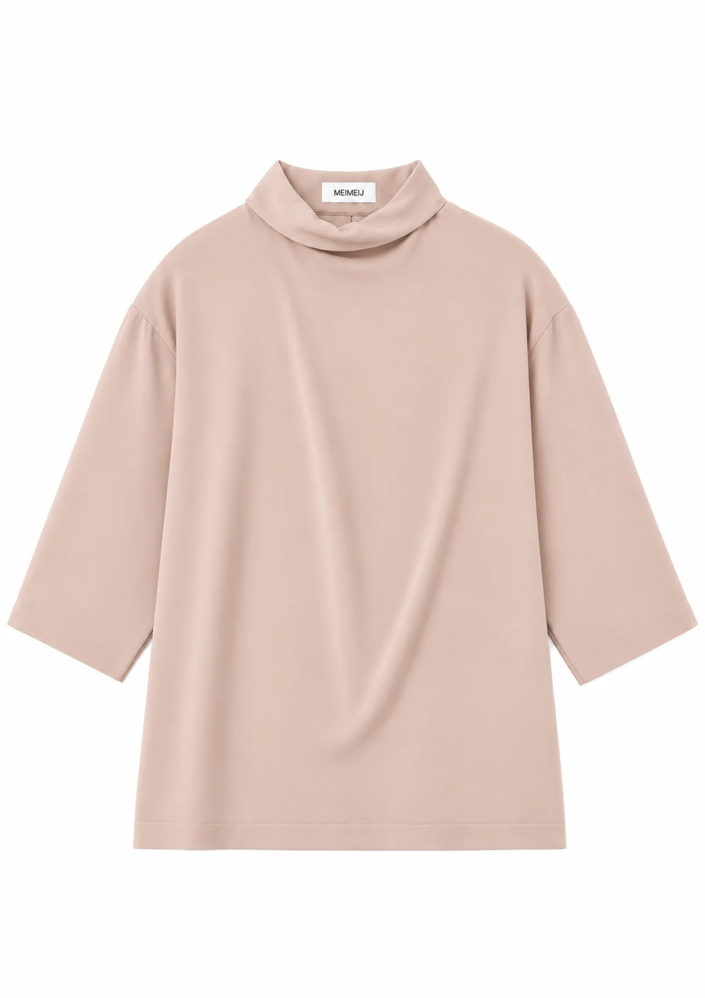 flat lay of a blush pink blouse on a white background
