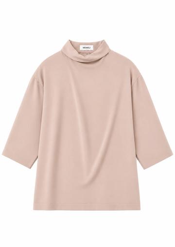 flat lay of a blush pink blouse on a white background