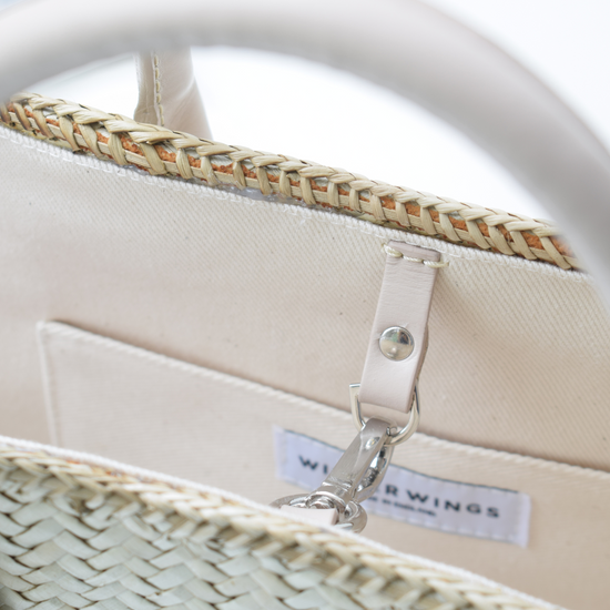 Hand woven natural tote lined in canvas and with leather handles