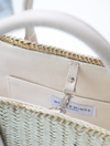 Hand woven natural tote lined in canvas and with leather handles