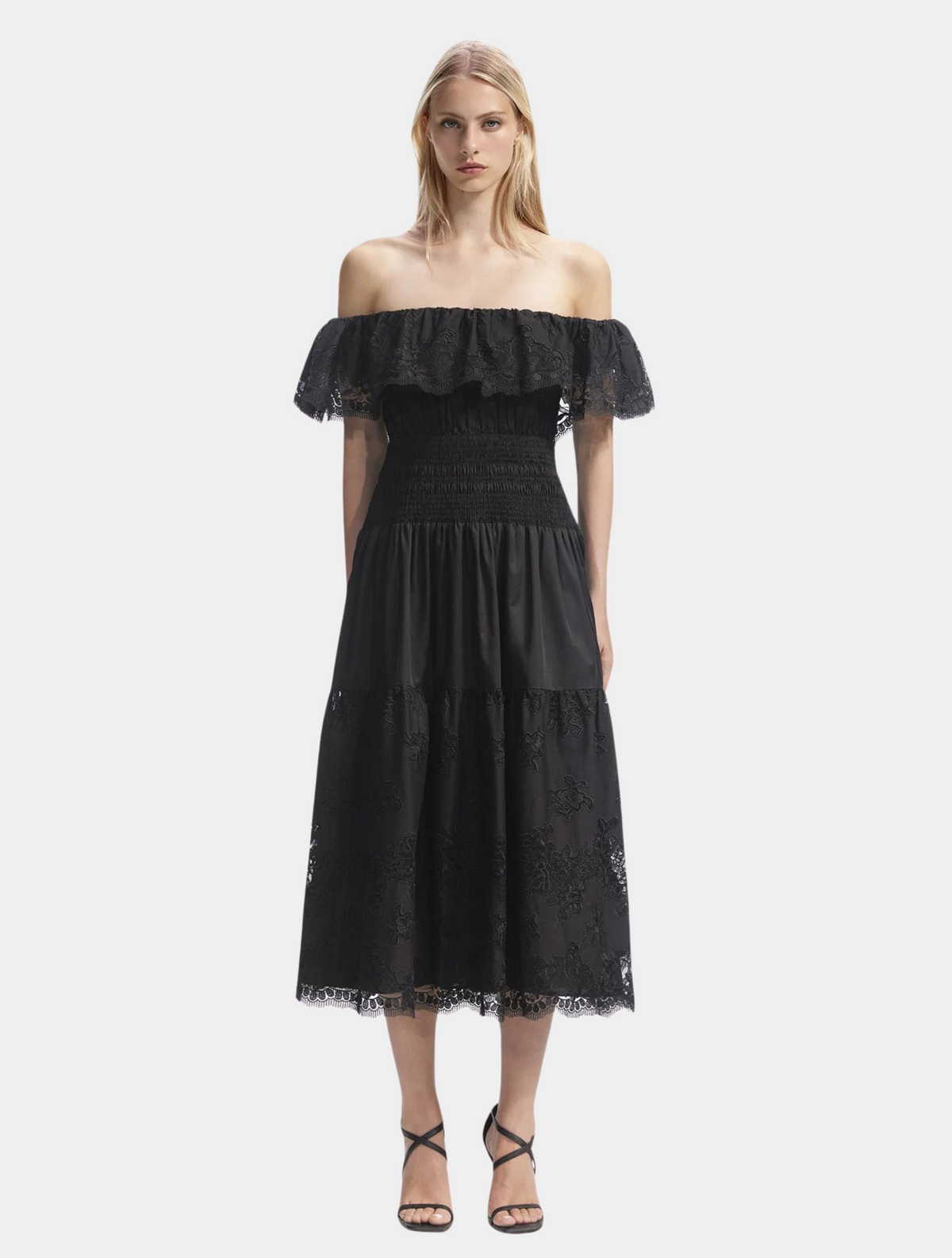Off the shoulder cotton black dress with lace around the bodice and lace trim with elasticated and ruched waistline