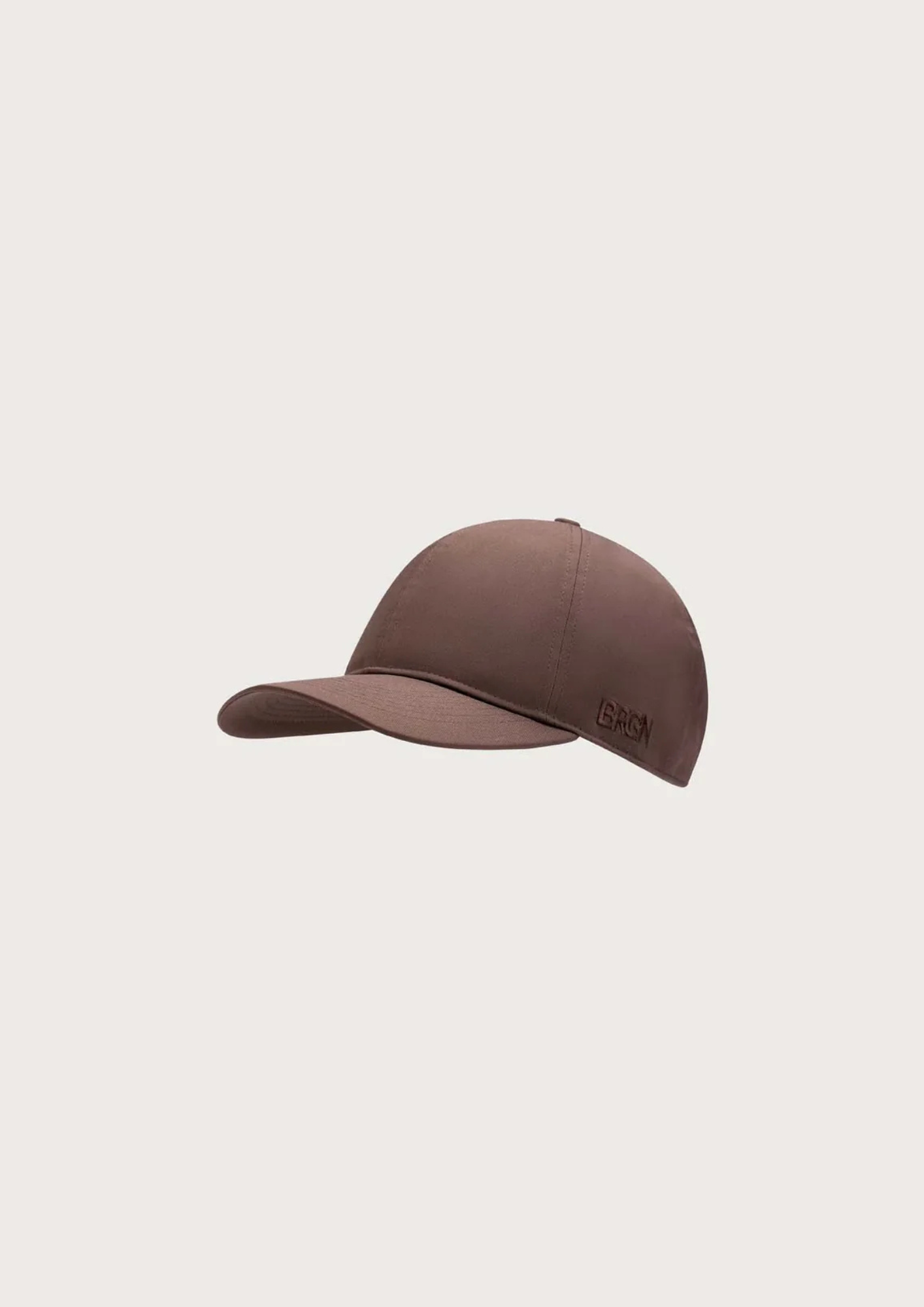 A brown baseball cap with a small embroidered logo on the side, shown against a solid light gray background.