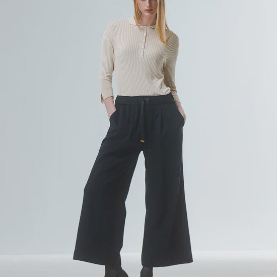 wide leg black culottes with drawstring waist and tie from emin and paul model shot