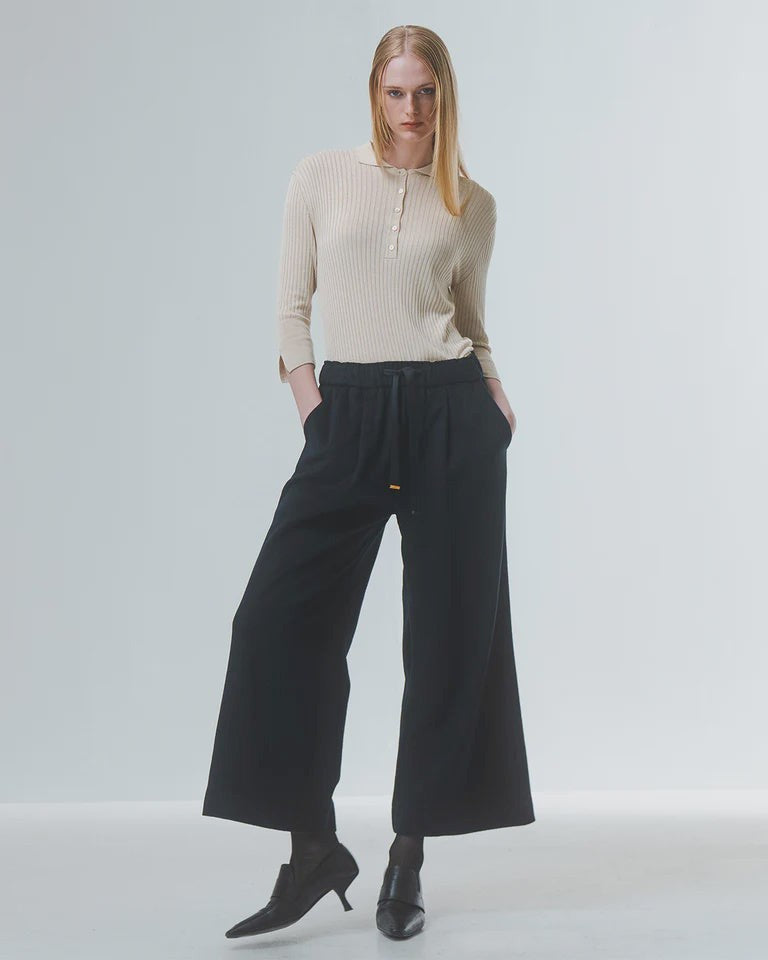 wide leg black culottes with drawstring waist and tie from emin and paul model shot