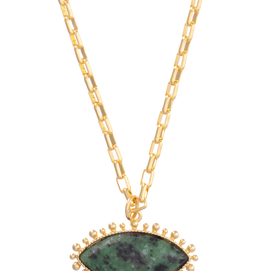 Green evil eye style necklace on a gold plated brass chain