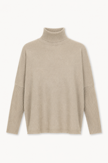 A light beige knit turtleneck sweater with ribbed sleeve cuffs, displayed against a clean white background.