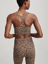 Brown and black animal print sports bra top with razor back and V neckline