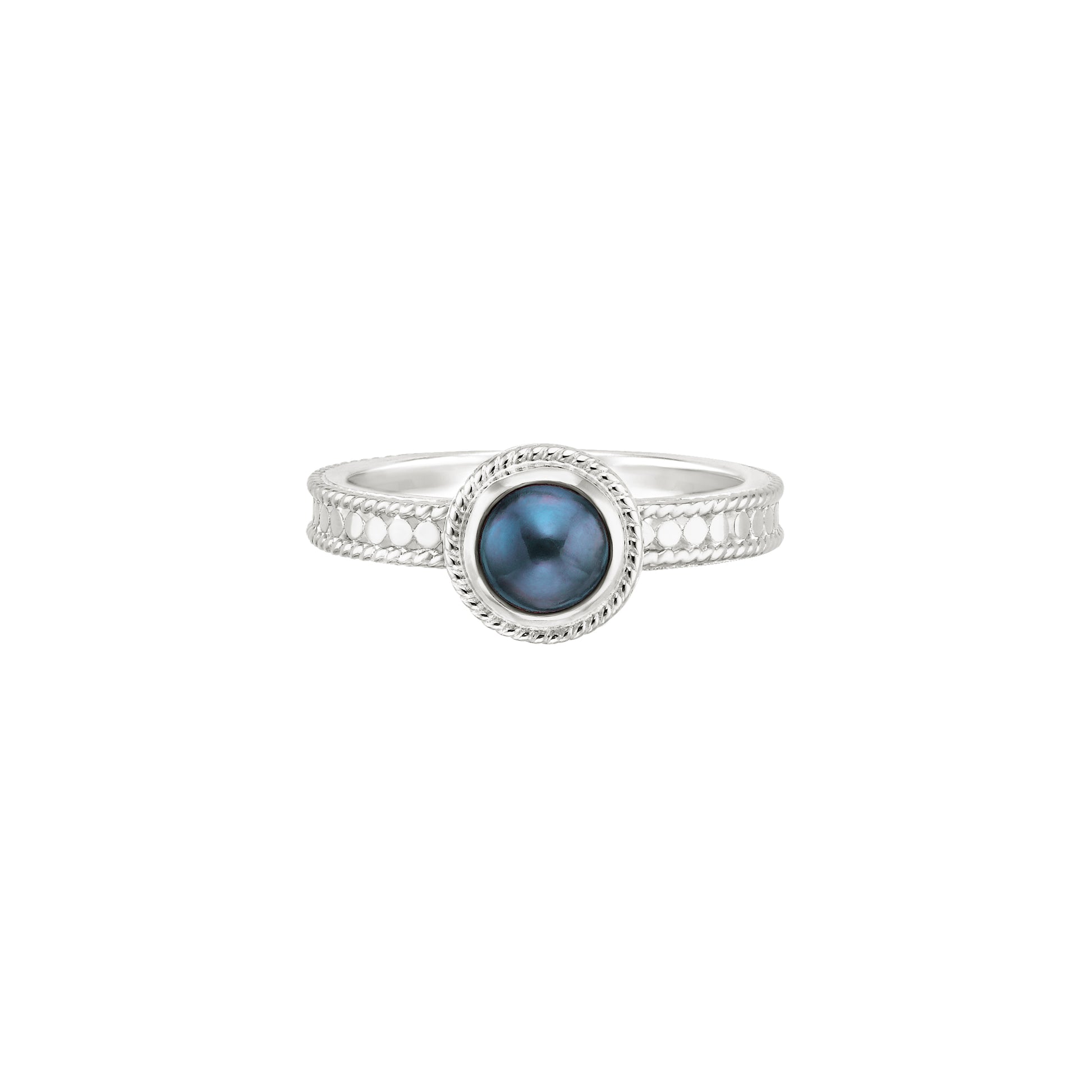 silver dotted ring with blue pearl in the centre
