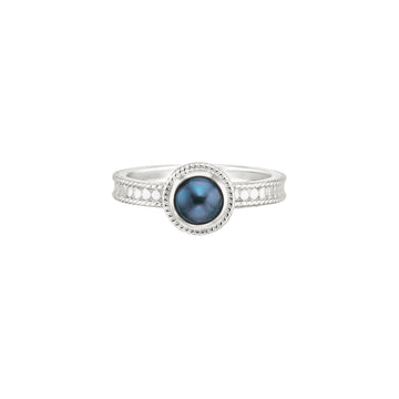 silver dotted ring with blue pearl in the centre