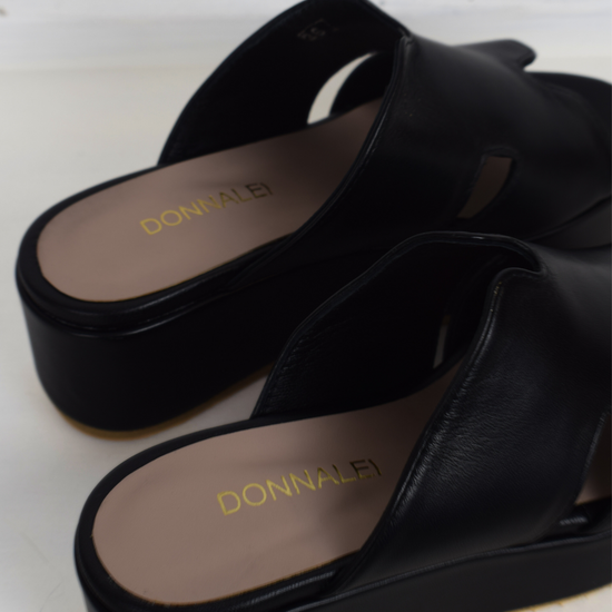 Black sandals with a large platform 