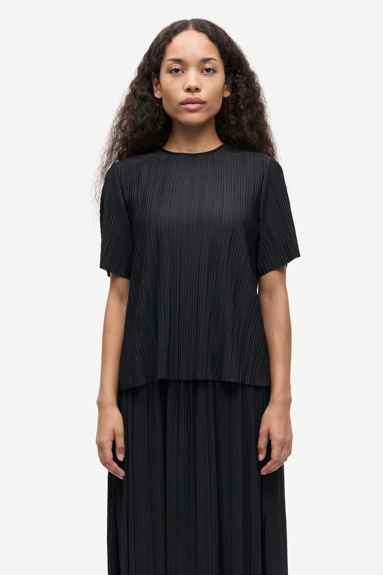 short sleeve pleated black top with round neck from samsoe samsoe model shot