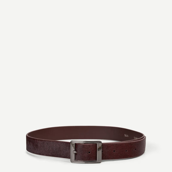 Maroon belt with a silver buckle on a white background