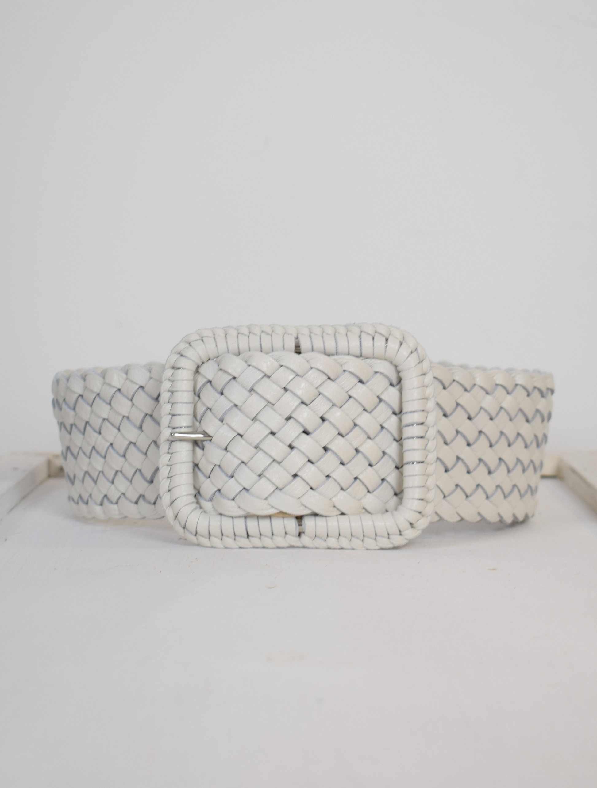 Wide plaited ivory leather belt with oblong leather bound buckle