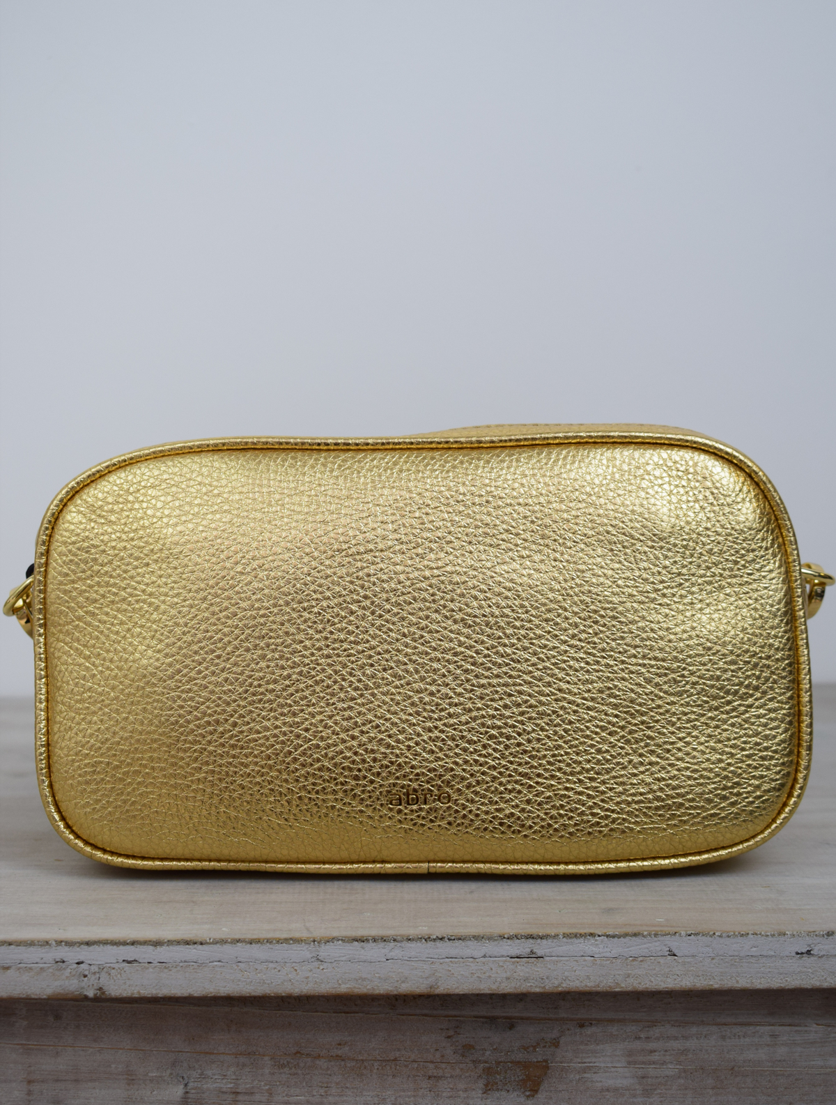 Gold coloured Italian leather small handbag with cross body strap