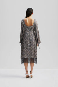 Blue grey and brown tile print fabric midi skirt with long fluted sleeves and fringe detail