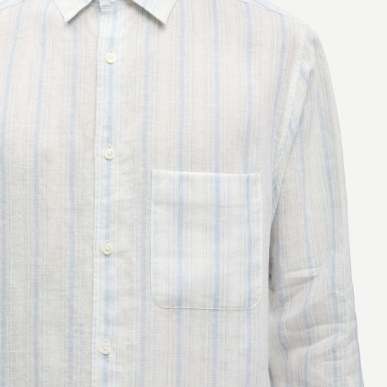 Light blue and white striped shirt by Samsoe Samsoe worn by a person on a white background close up