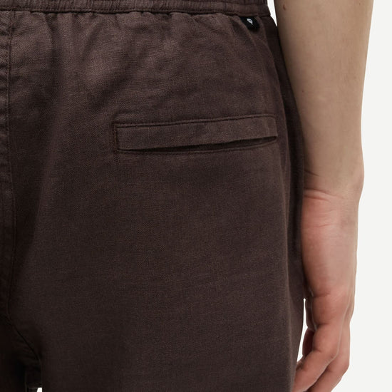 Brown pants by Samsoe Samsoe with a pocket on a white background