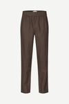 Brown trousers by Samsoe Samsoe on a white background