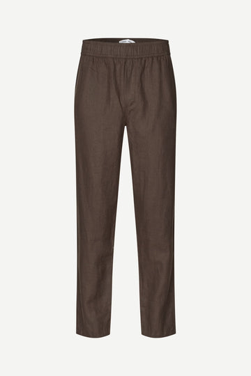 Brown trousers by Samsoe Samsoe on a white background