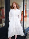 White midi dress with three quarter length sleeves and drawstring waist in eyelet fabric