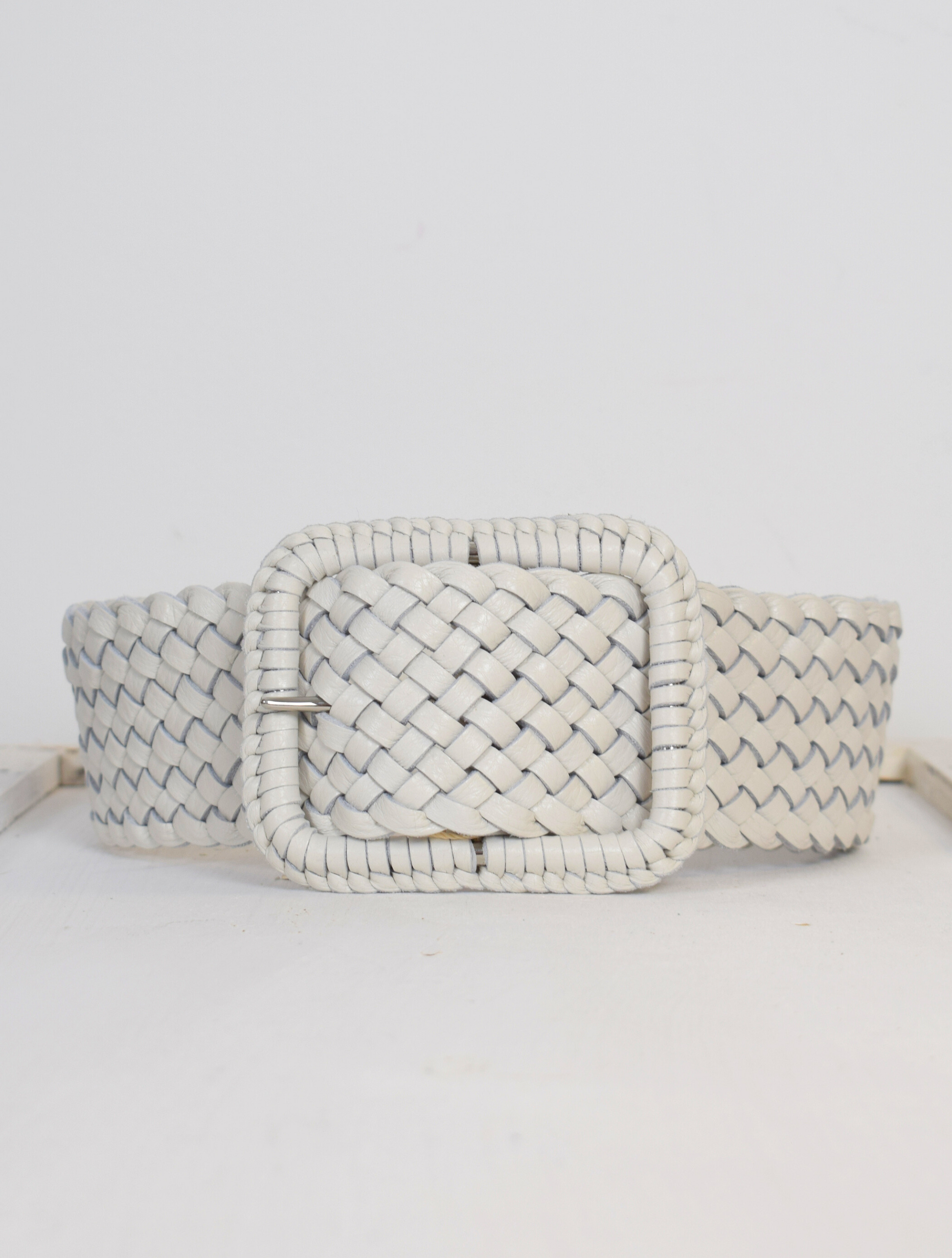 Wide plaited ivory leather belt with oblong leather bound buckle