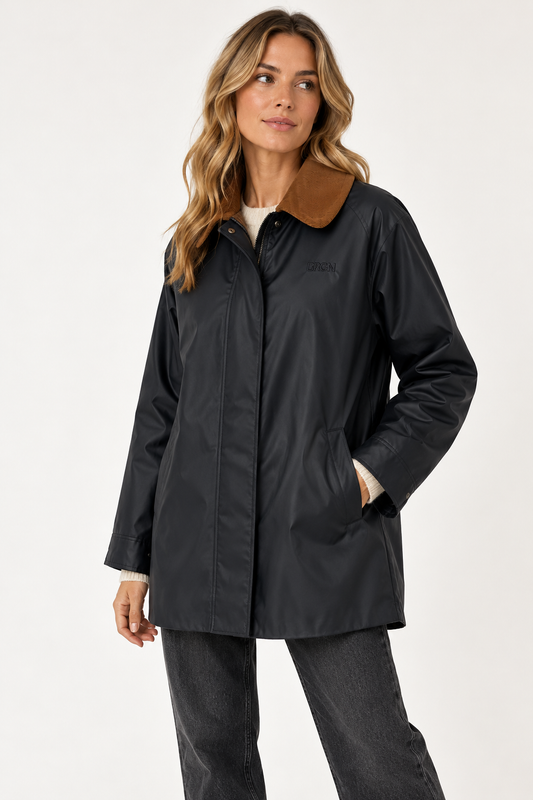 Model shown wearing a black wax coating jacket with a tan cord collar on a plain white background