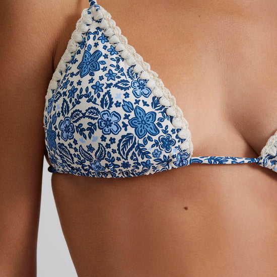 Triangle string bikini top with blue and white floral print and crotch trim