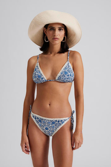 Blue and ivory floral bikini bottoms with crocheted trim and tie sides