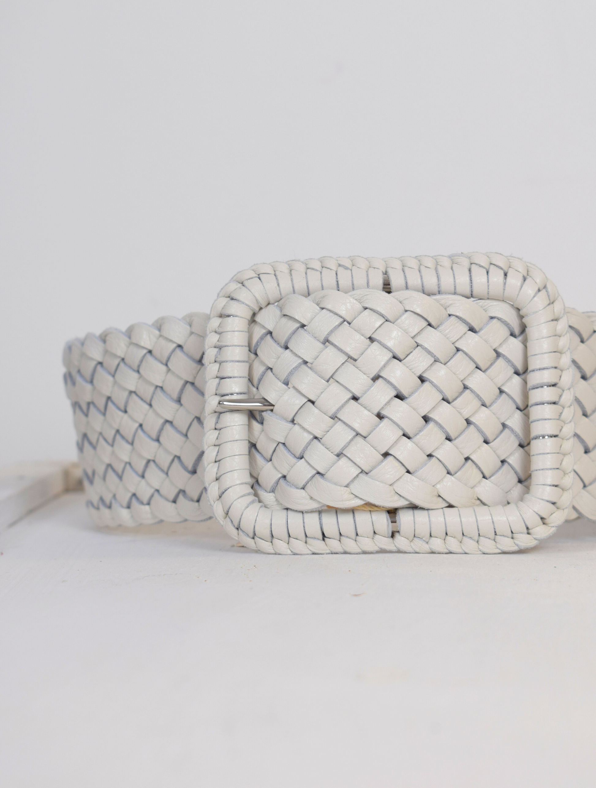 Wide plaited ivory leather belt with oblong leather bound buckle