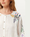 round neck white linen button down blouse with embroidered detailing from me369 close up