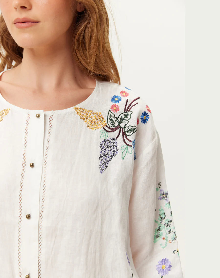 round neck white linen button down blouse with embroidered detailing from me369 close up