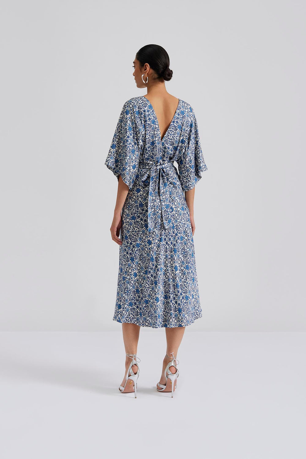 Blue ditsy floral V neck midi dress with elbow length sleeves and v back line with fabric tie